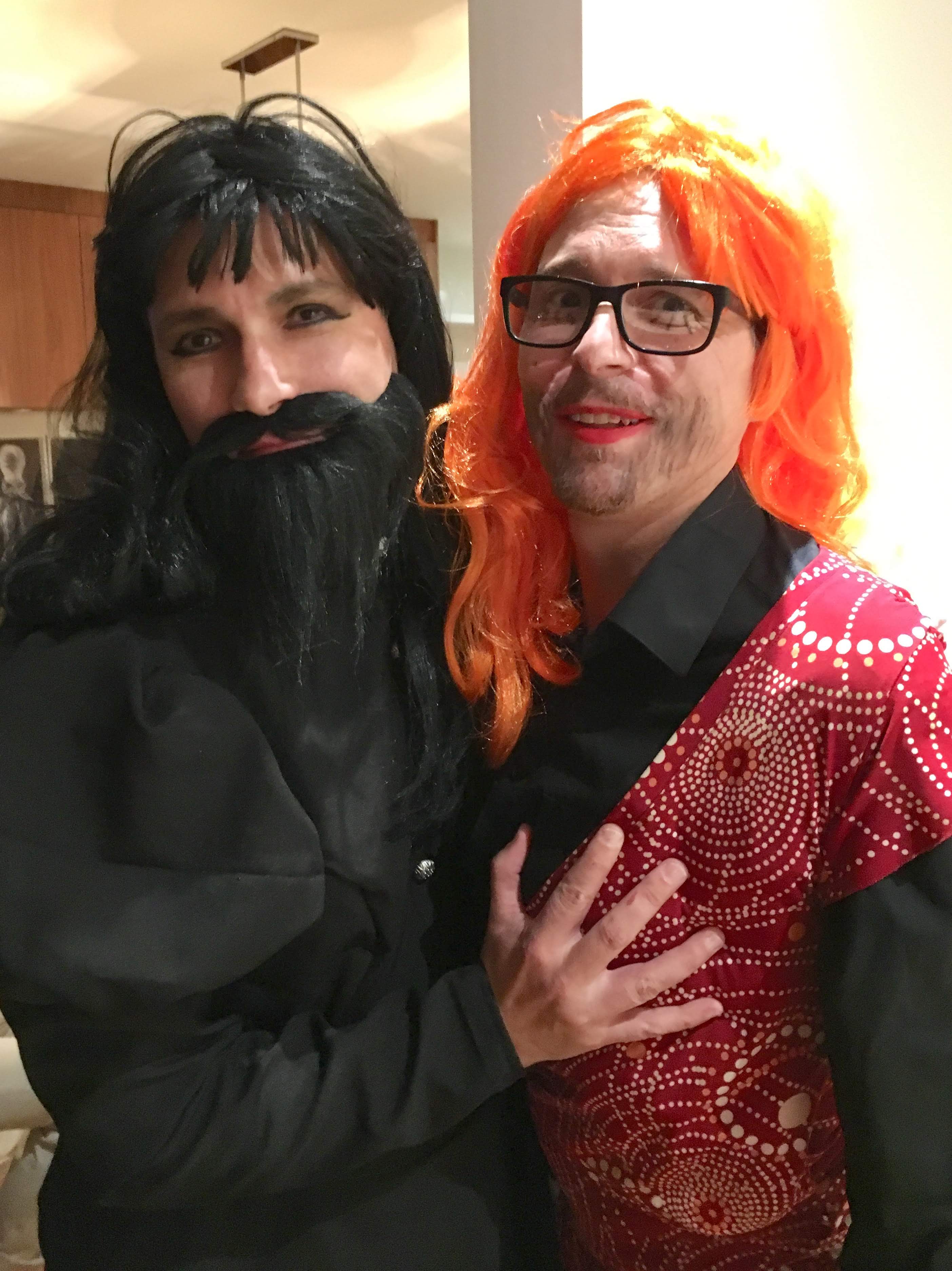 Two men dressed as bearded ladies